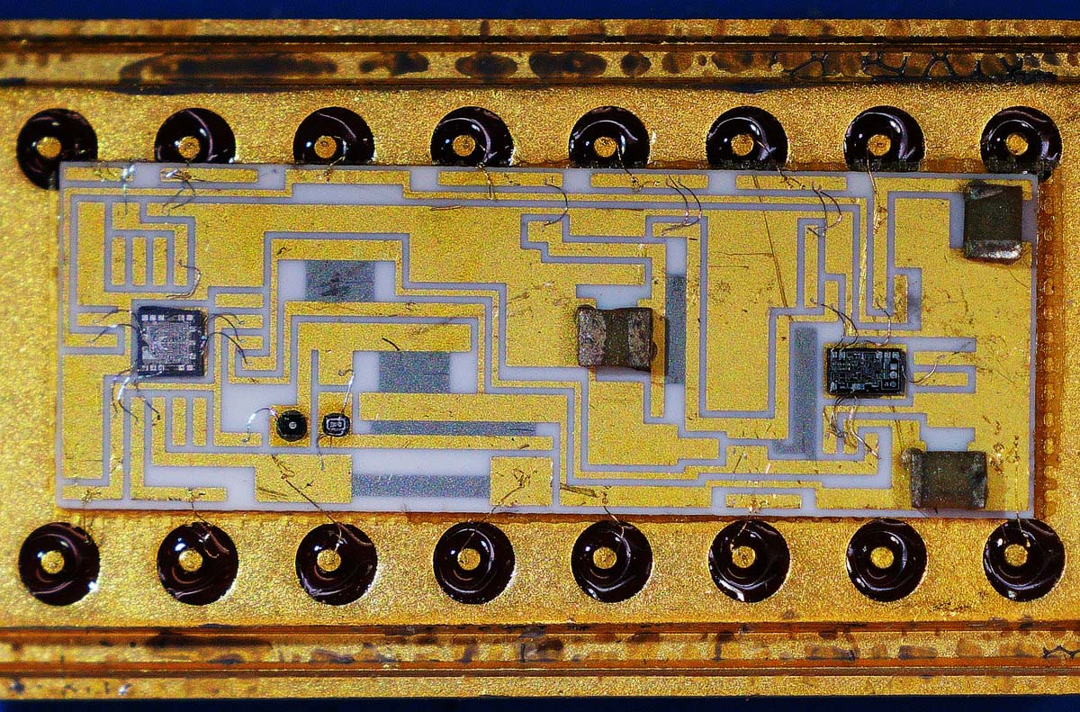 Hybrid device with surface-mount resistors and two smaller chips