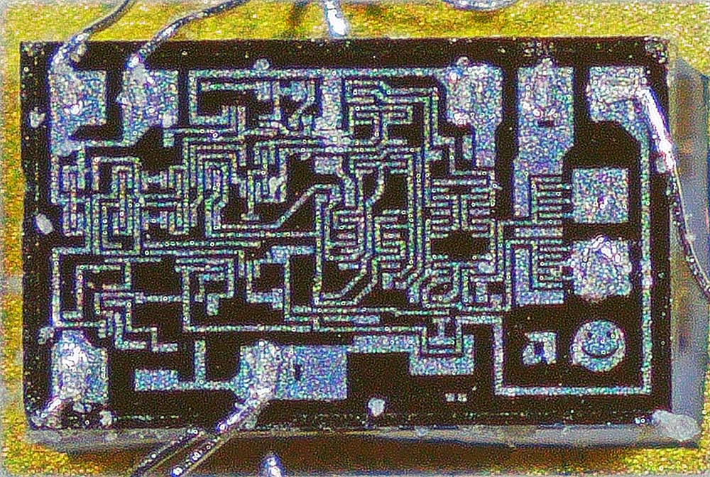 Detail of hybrid device showing a chip with a happy face
