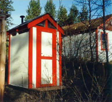 Small wooden outhouse
